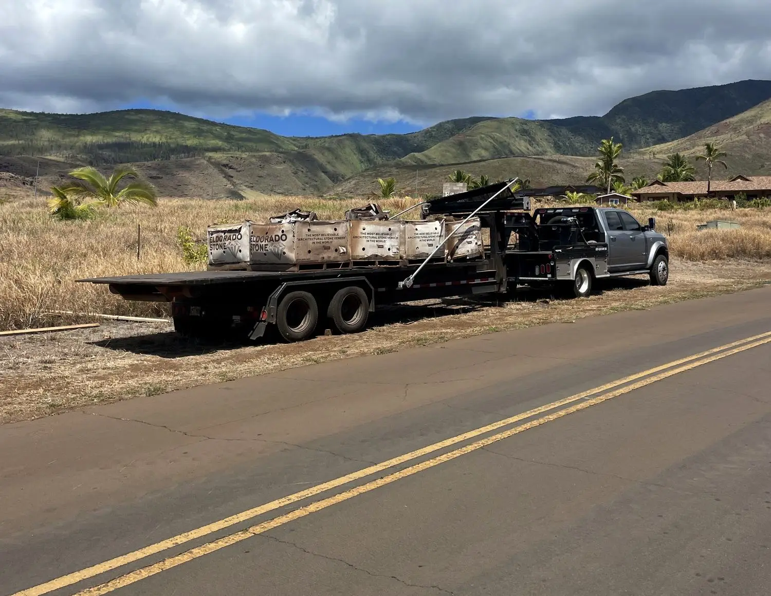 Hawaii Hauling's truck and flatbed on a West Maui road