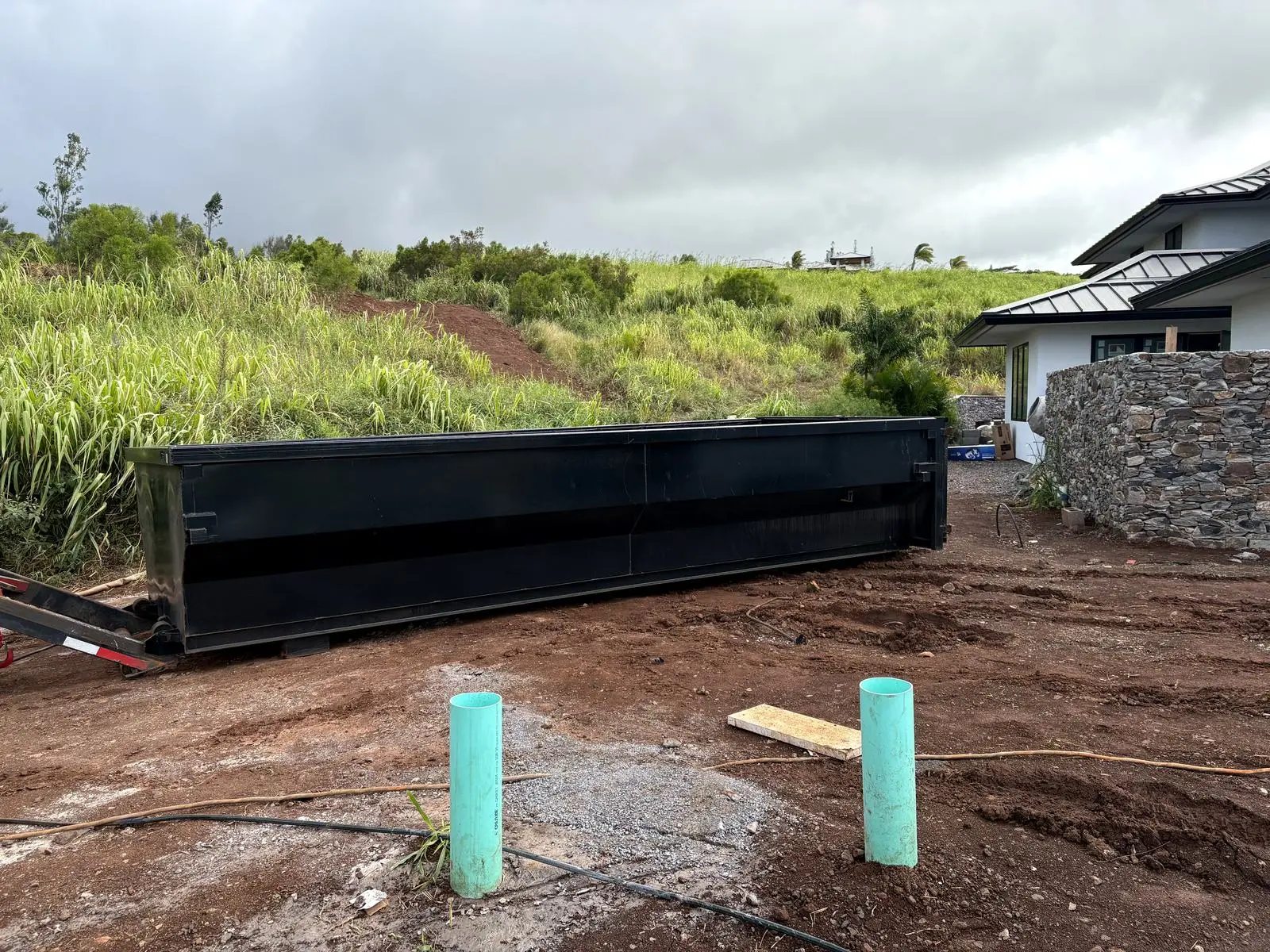 A Hawaii Hauling roll-off bin on a Maui construction site